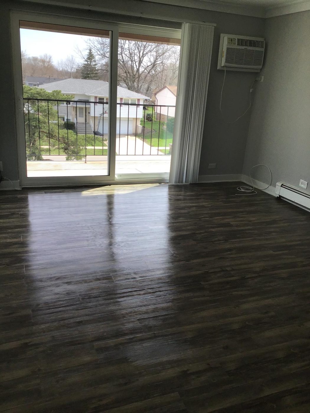 Townhome living room after cleaning — polished, spotless floors